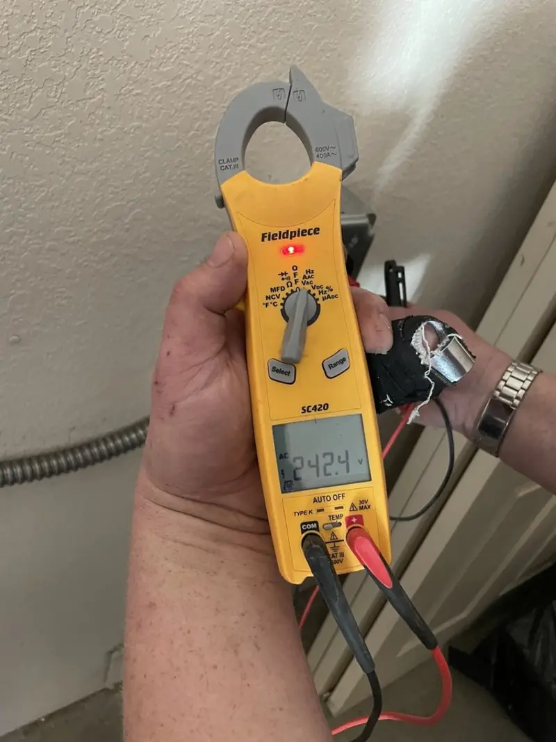 Voltage testing with clamp meter during Electrical Installation Services in Quartz Hill